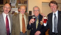 Rotarians Edwards, Lawrence, Robertson and Townsend enjoy banter and an aperitif