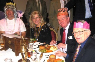 The top table has a special guest. Sharing the joke with President Sue are Rotarians Perry, Castle and Cliff